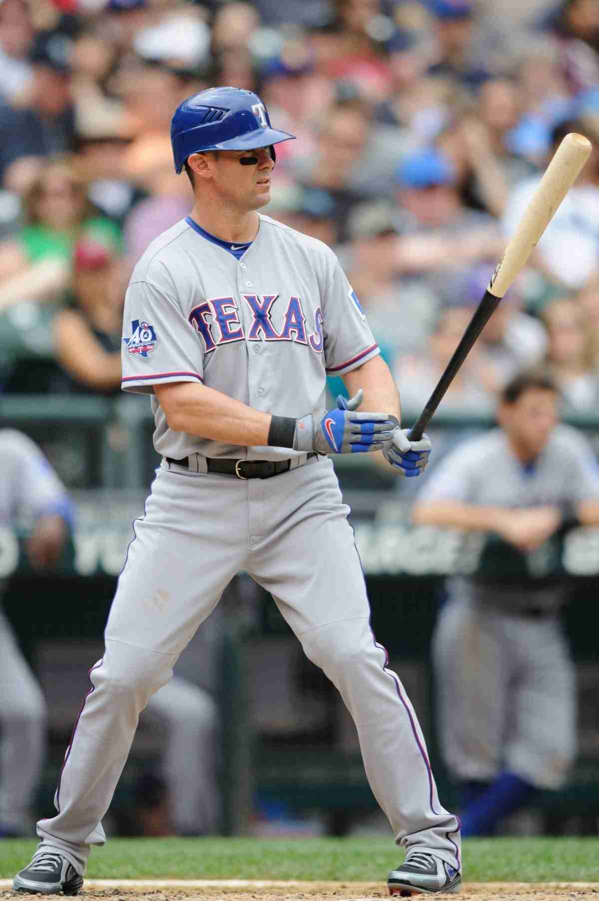 Former Texas Rangers star Michael Young is greeted by his son
