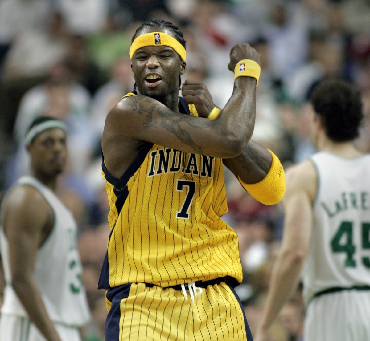 Indiana Pacers forward Jermaine O'Neal, front, reacts after